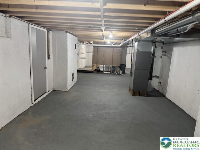 unfinished basement with heating unit