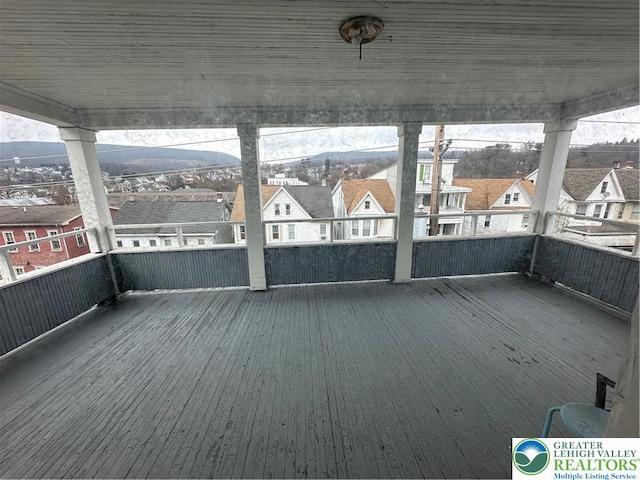 unfurnished sunroom featuring a residential view
