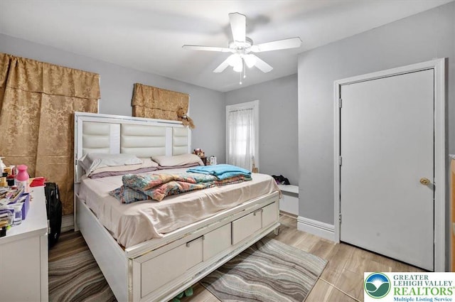 bedroom featuring a ceiling fan and light wood-style floors