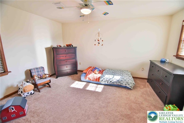 bedroom with carpet and baseboards