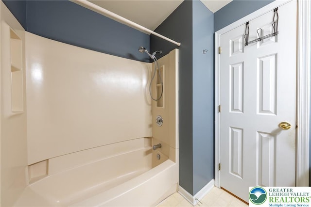 full bathroom with bathtub / shower combination and baseboards