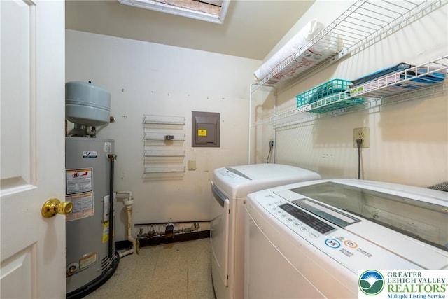 laundry area with independent washer and dryer, electric panel, laundry area, water heater, and light floors