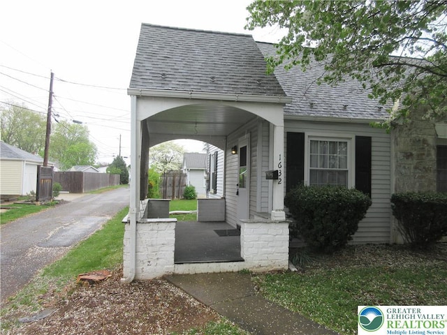 surrounding community with driveway and fence