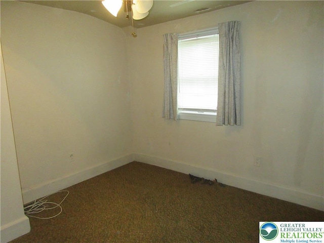 spare room with a ceiling fan, carpet flooring, and baseboards
