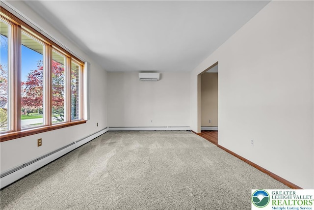 empty room with baseboard heating, a baseboard heating unit, baseboards, a wall mounted AC, and carpet