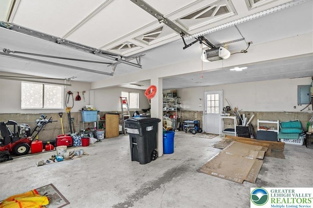 garage featuring a garage door opener and electric panel