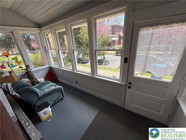 sunroom / solarium with wooden ceiling and vaulted ceiling