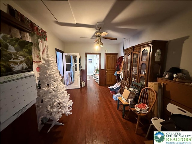 interior space with a ceiling fan and wood-type flooring