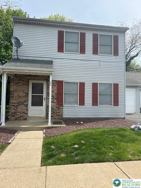 22 Fort Lee Ct, Forks Twp, PA 18040 - view of front facade featuring a front lawn and brick siding