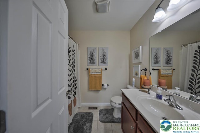 bathroom featuring tile patterned floors, visible vents, toilet, and vanity