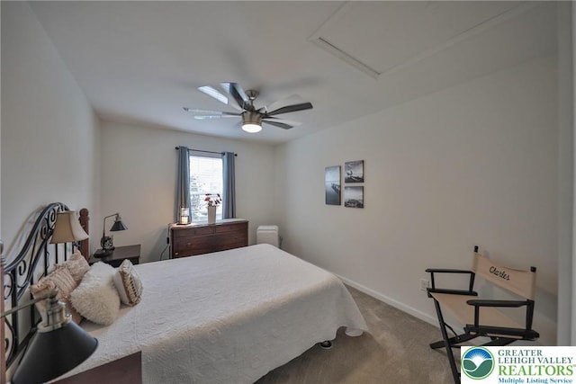 bedroom featuring attic access, carpet flooring, ceiling fan, and baseboards