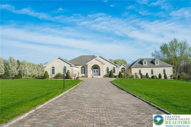 901 Meyer Rd, Bushkill Twp, PA 18064 - french country home with a front lawn and decorative driveway