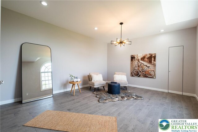 901 Meyer Rd, Bushkill Twp, PA 18064 - sitting room featuring a chandelier, wood finished floors, recessed lighting, baseboards, and a skylight