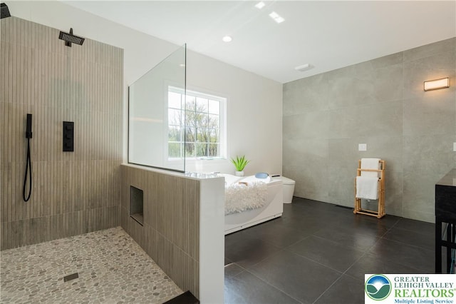 901 Meyer Rd, Bushkill Twp, PA 18064 - full bath featuring tile walls, a walk in shower, and tile patterned floors