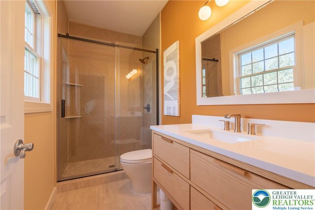 901 Meyer Rd, Bushkill Twp, PA 18064 - bathroom with a shower stall, vanity, and toilet