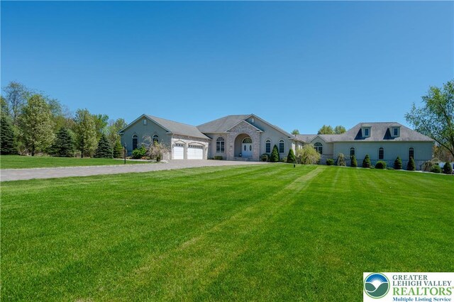 901 Meyer Rd, Bushkill Twp, PA 18064 - view of front facade featuring an attached garage, driveway, and a front lawn