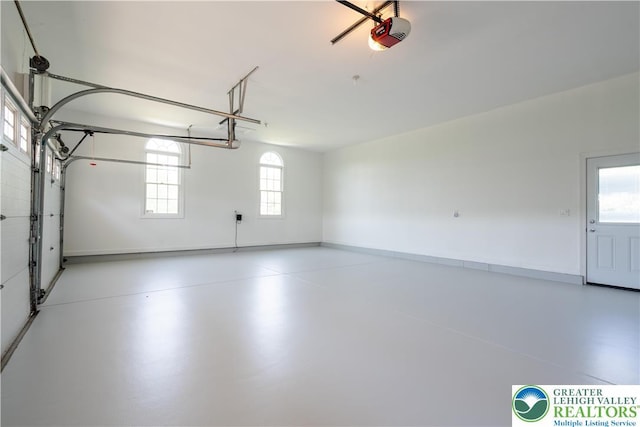901 Meyer Rd, Bushkill Twp, PA 18064 - garage with a garage door opener and baseboards