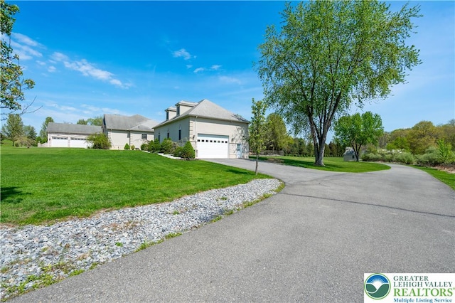 901 Meyer Rd, Bushkill Twp, PA 18064 - view of front of house with a front yard, driveway, and an attached garage