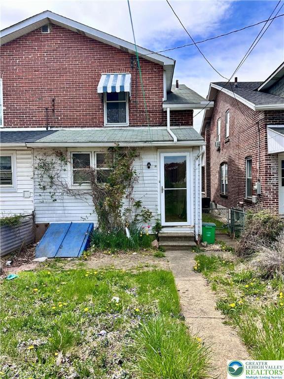back of property with fence