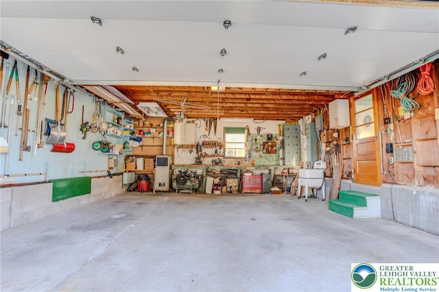 garage with a workshop area