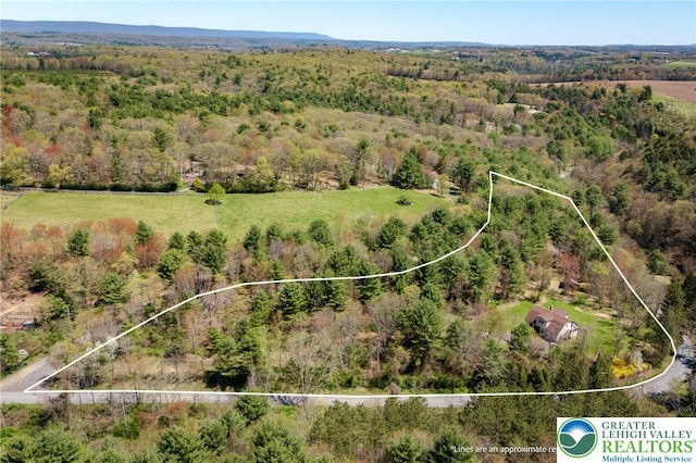 aerial view featuring a view of trees