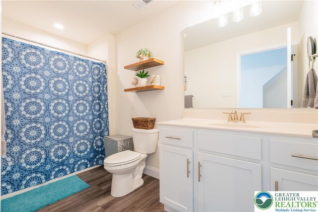 131 Chinaberry Way, Polk Twp, PA 18058 - full bathroom featuring visible vents, curtained shower, wood finished floors, vanity, and toilet