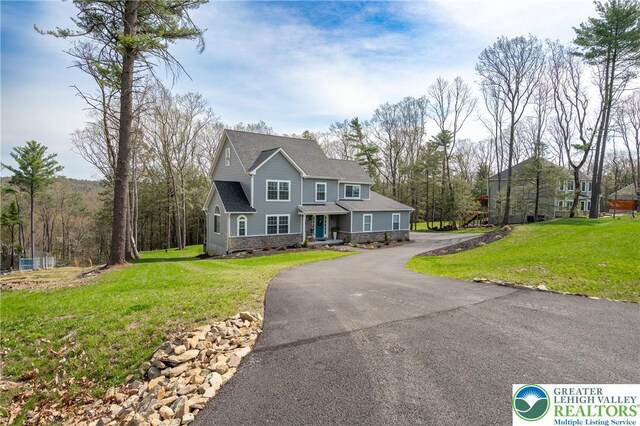 131 Chinaberry Way, Polk Twp, PA 18058 - view of front of house with a front yard and stone siding