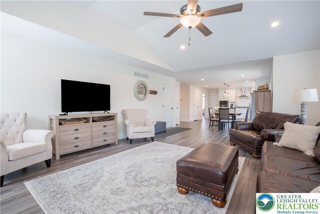 131 Chinaberry Way, Polk Twp, PA 18058 - living area with lofted ceiling, recessed lighting, wood finished floors, and visible vents