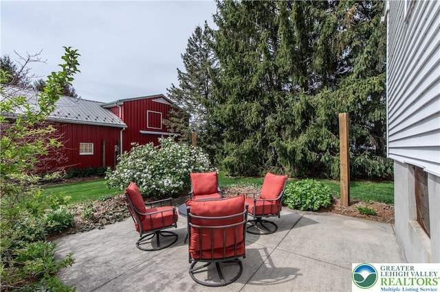 view of patio / terrace featuring an outbuilding