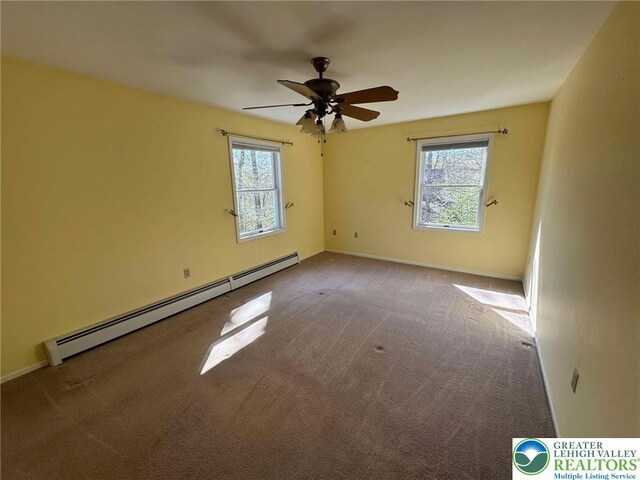 91 Alpine Dr, Jim Thorpe Boro, PA 18229 - spare room featuring a baseboard heating unit, carpet flooring, and ceiling fan
