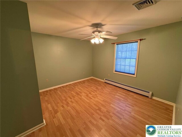 91 Alpine Dr, Jim Thorpe Boro, PA 18229 - unfurnished room featuring a baseboard heating unit, wood finished floors, and ceiling fan