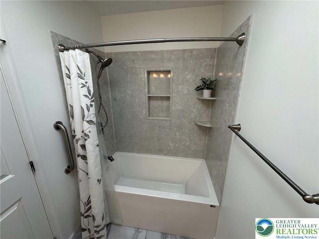 bathroom featuring shower / bath combo with shower curtain