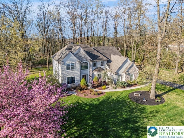 8750 Summit Cir, Weisenberg Twp, PA 18051 - view of front of house featuring stone siding and a front yard