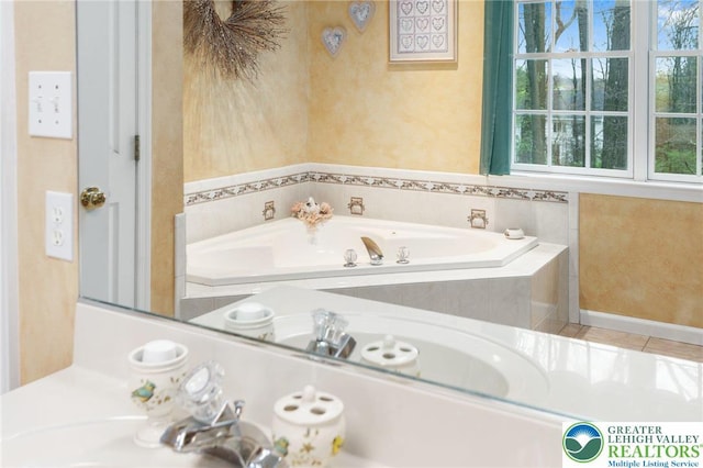 bathroom featuring a garden tub and tile patterned floors