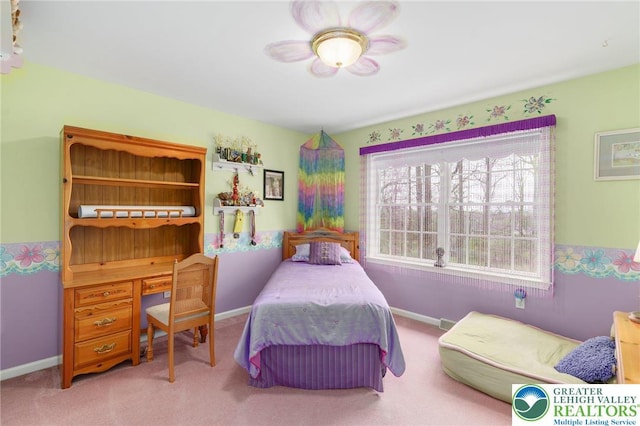 bedroom with baseboards and carpet