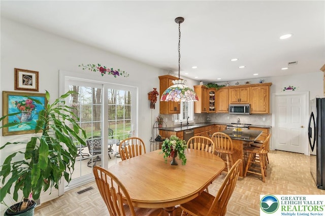 dining area with recessed lighting and visible vents