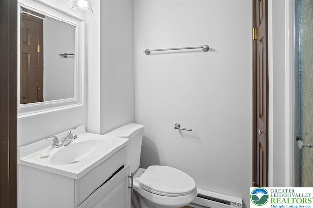 bathroom with toilet, baseboard heating, and vanity