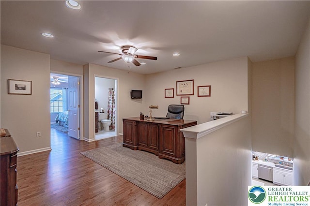 office space with baseboards, recessed lighting, ceiling fan, and wood finished floors