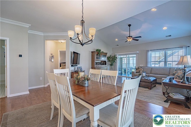 dining space with visible vents, wood finished floors, baseboards, recessed lighting, and ceiling fan with notable chandelier