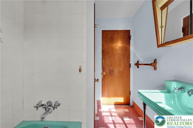 bathroom featuring vanity and  shower combination