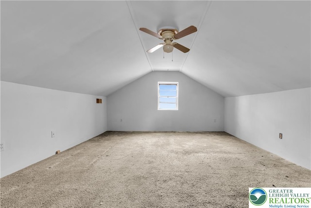 bonus room with carpet floors, a ceiling fan, and lofted ceiling