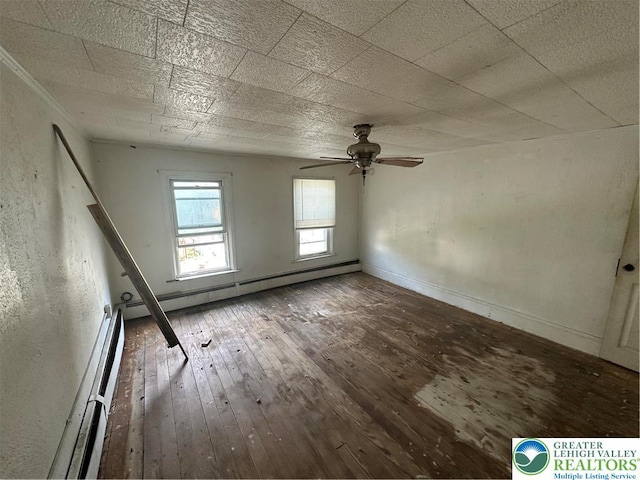 empty room with a baseboard radiator, ceiling fan, and hardwood / wood-style floors