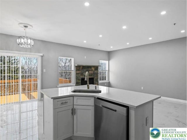 kitchen with a sink, stainless steel dishwasher, recessed lighting, and a wealth of natural light