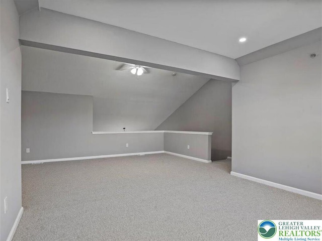 bonus room featuring carpet flooring, ceiling fan, baseboards, and lofted ceiling