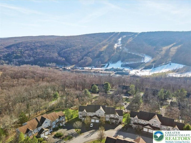 mountain view featuring a residential view and a wooded view