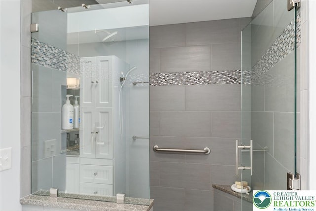 full bathroom featuring a shower stall
