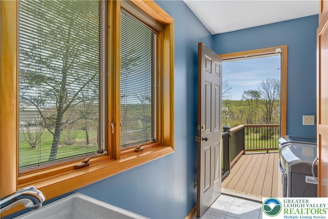 doorway to outside featuring tile patterned flooring