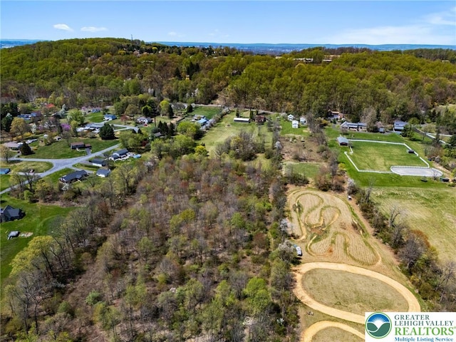 drone / aerial view with a forest view