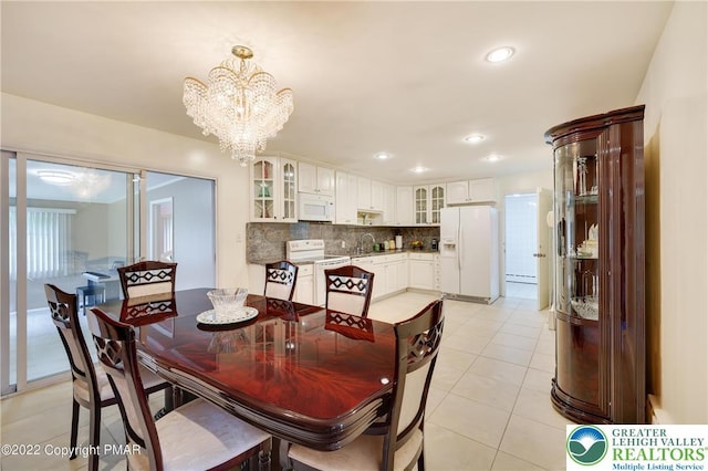 dining area featuring recessed lighting, a notable chandelier, and light tile patterned floors