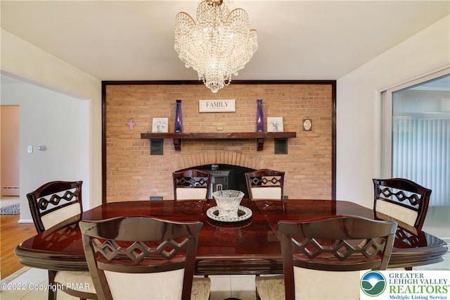 dining room featuring an inviting chandelier and a baseboard radiator